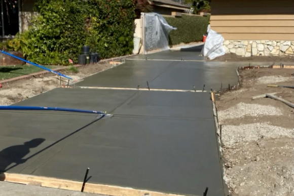 this image shows concrete driveway in Huntington Beach, California